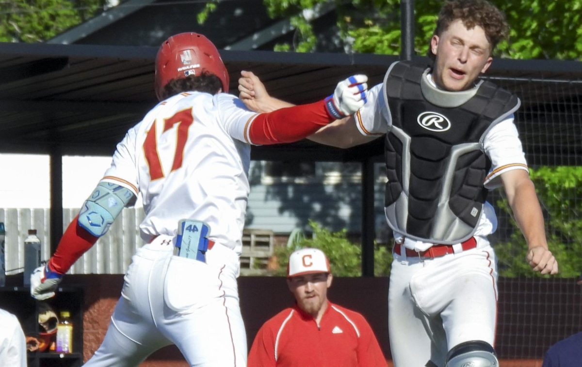 (Thumb) CHS baseball junior Wyatt Gordon (left) jumps in celebration with junior Landon Shafer (right) after Gordon hit a three run homerun in the third inning of the Trojans 7-3 win against the Mt. Zion High School Braves at Baker Field on Wednesday.