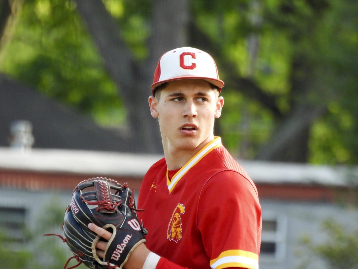 CHS baseball junior pitcher Russ Applegate prepares to throw a pitch in the fifth inning of the Trojans 5-1 loss to Mattoon High School at Baker Field  on Thursday.