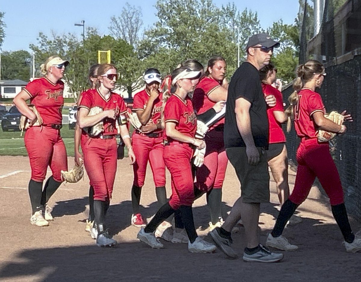 The Charleston High School softball team walks back to the dugout during its game against Windsor Stewartson-Strasburg High School on Wednesday at Karch Field.