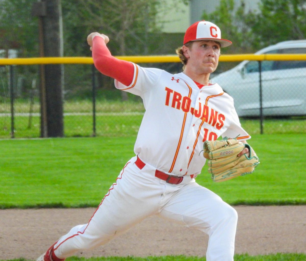 Charleston High School senior pitcher Alex Matheny throws a pitch in the first inning of the Trojans’ game against Taylorville High School at Baker Field on Tuesday.