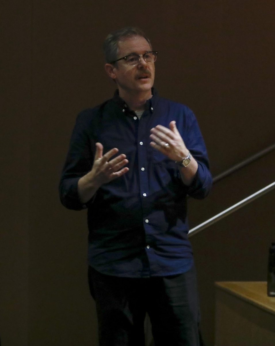 Brad Decker, assistant professor of music composition and history, asks the panelists questions about student safety, security and support during the Faculty Panel on Wednesday in the Doudna Fine Arts Center.