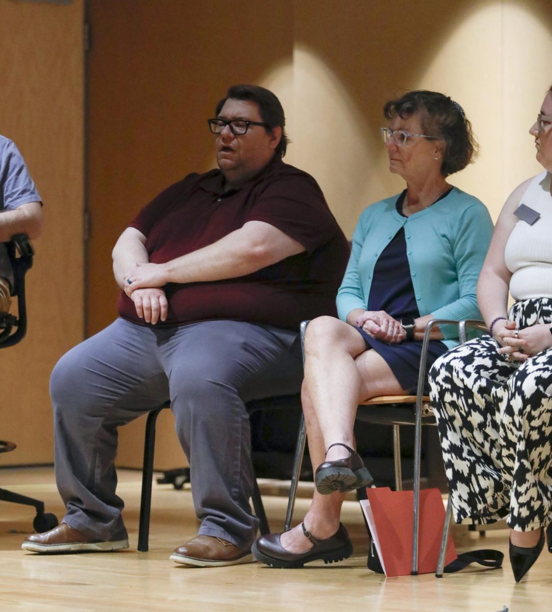 Tyler Custer, the interim director of international programs, introduces himself during the Faculty Forum on Wednesday in the Lecture Hall in Doudna Fine Arts Center.