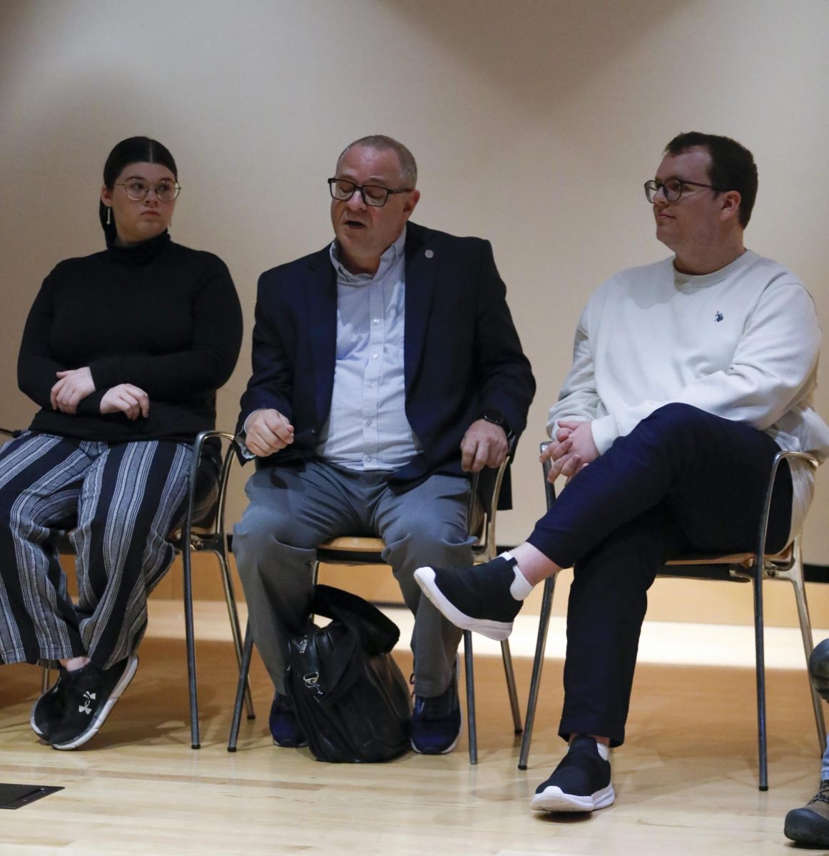 Eric Davidson discusses a question about accommodations at the Wednesday Faculty Forum panel in the Lecture Hall in the Doudna Fine Arts Center.