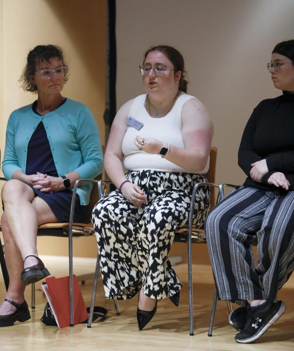 Sophomore political science major Claire Weber responds to questions provided by Brad Decker at the Faculty Forum on Wednesday in the lecture hall inside of the Doudna Fine Arts Center. The panelists answered questions about accommodations and students.