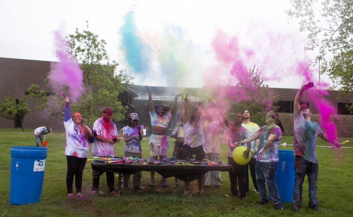 Holi Color Fest participants throw pigment at the sky on Friday on the Library Quad. Holi Color Fest lasted from 1 P.M. until 4 P.M. with a large color toss at 2 P.M.