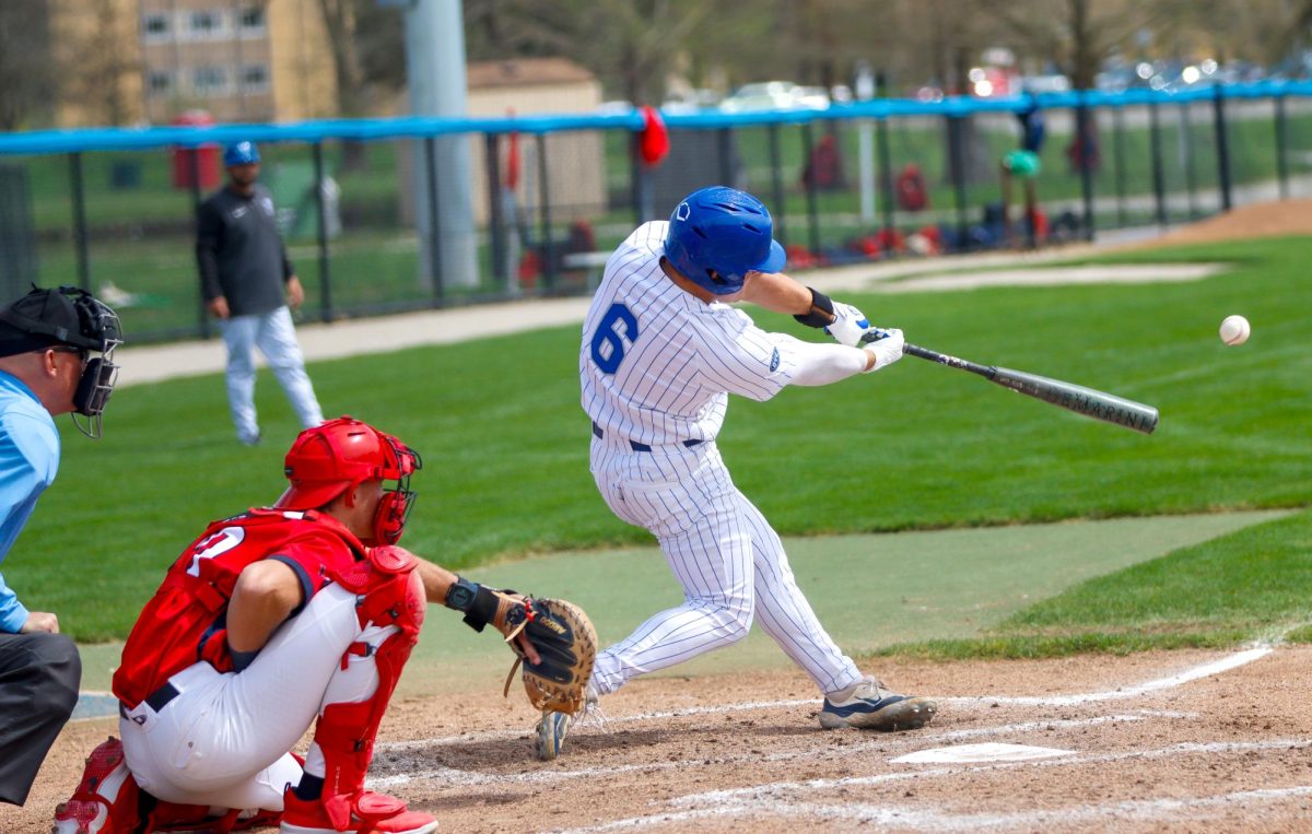 EIU graduate infielder Brett Stanley hits the ball during Eastern baseball's 3-1 win over Southern Indiana. He extended his hitting streak to 28 games.
