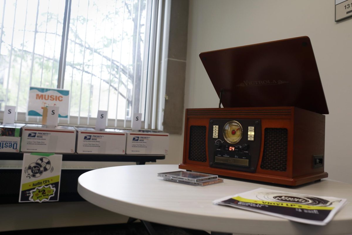 A record player plays classical music at the Media Mayhem event at Booth Library Wednesday afternoon.