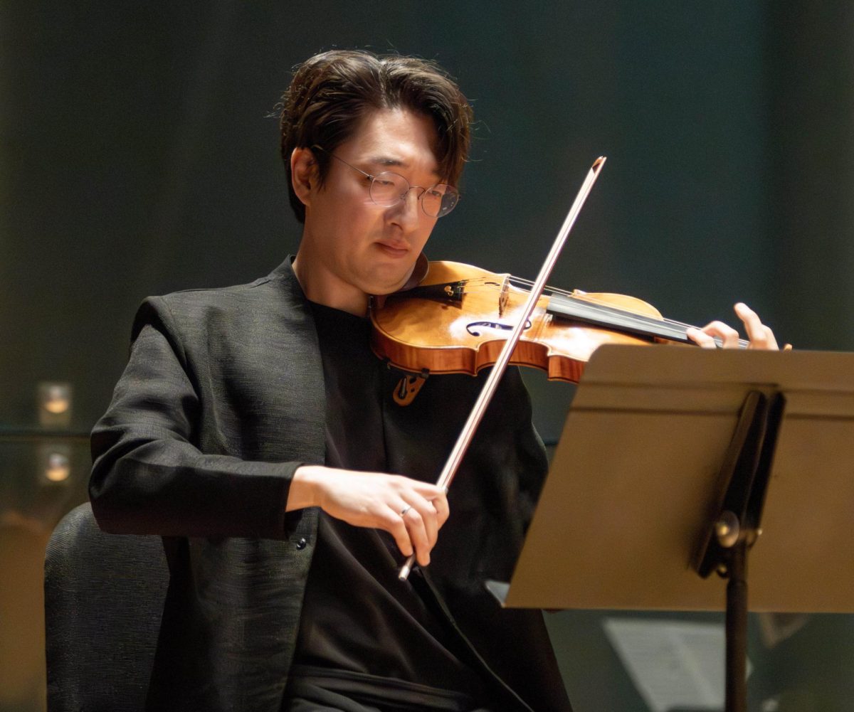 Eastern Illinois University music faculty member Ji Myung Kim plays the violin during Beethoven’s Septentrional at the EIU Faculty Chamber Concert at the Doudna Recital Hall on Monday night.