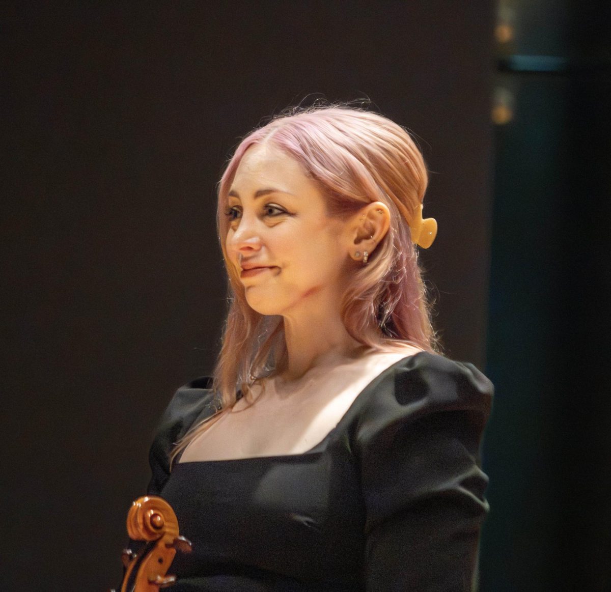 Guest artist Erin Rafferty smiles to the crowd as they applaud her after the EIU Faculty Chamber Concert at the Doudna Recital Hall on Monday night.