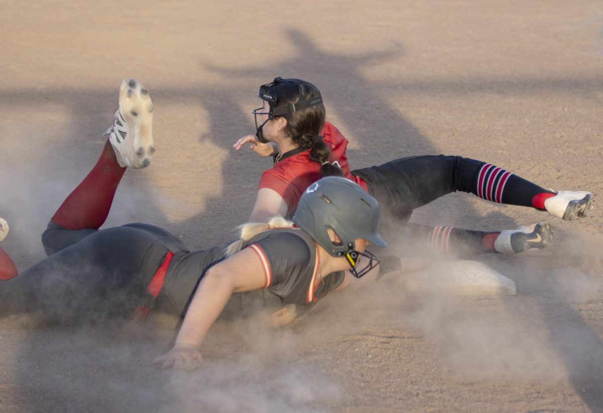 Lainie Keefer slides into 3rd base safely in the second game of a CHS softball doubleheader against Mt. Zion High School on Thursday at Karch Field.