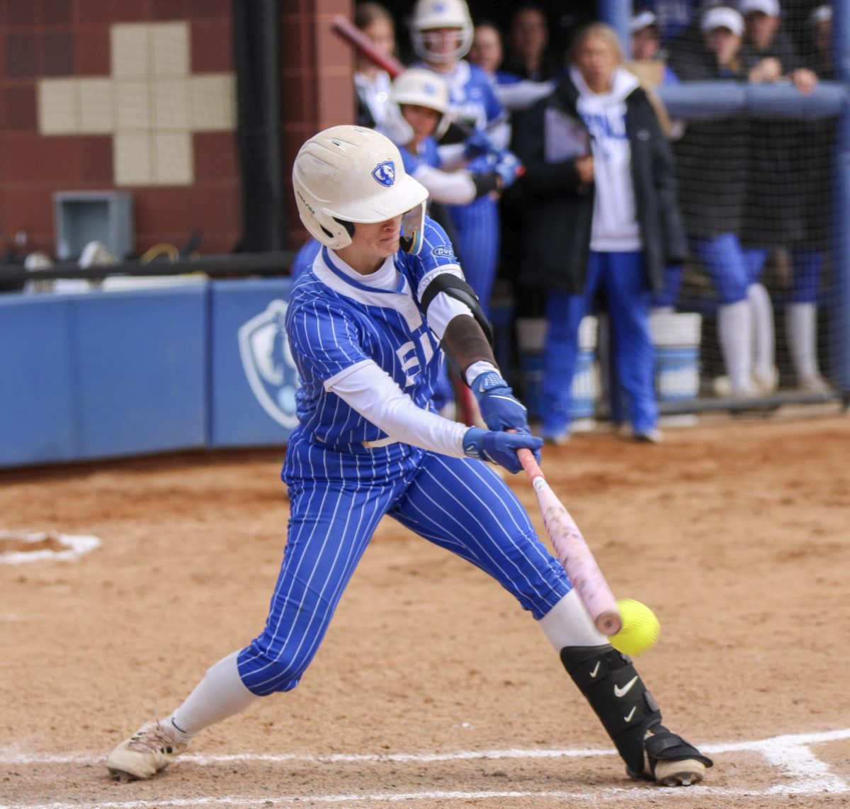 Catcher junior Sophia Olman reaches out and knocks a ball into play down the 3rd base line during the EIU softball game against Tennessee Tech on Saturday where the panthers won 6-0 at Williams Field.