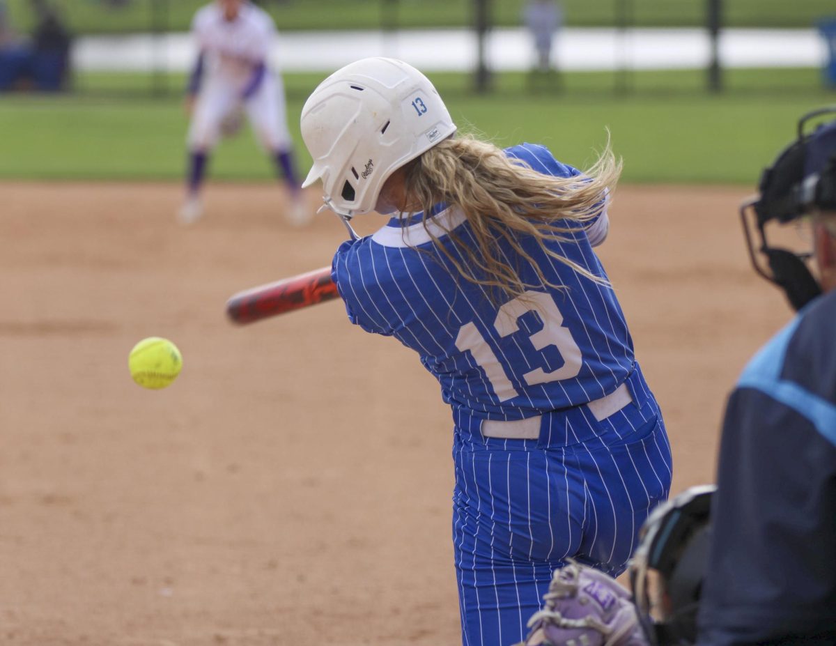 Infield junior Alisha Frederick hits a ball towards the Tennessee Tech second baseman during the second game of a double header on Saturday where the EIU softball team won 6-0 at Williams Field.