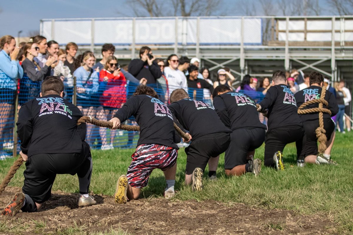 Members of fraternity Sigma Phi Epsilon set up for Tugs before the horn signals the beginning of their match against Phi Kappa Theta at the Tugs event during Greek Week across the campus pond on Wednesday afternoon.