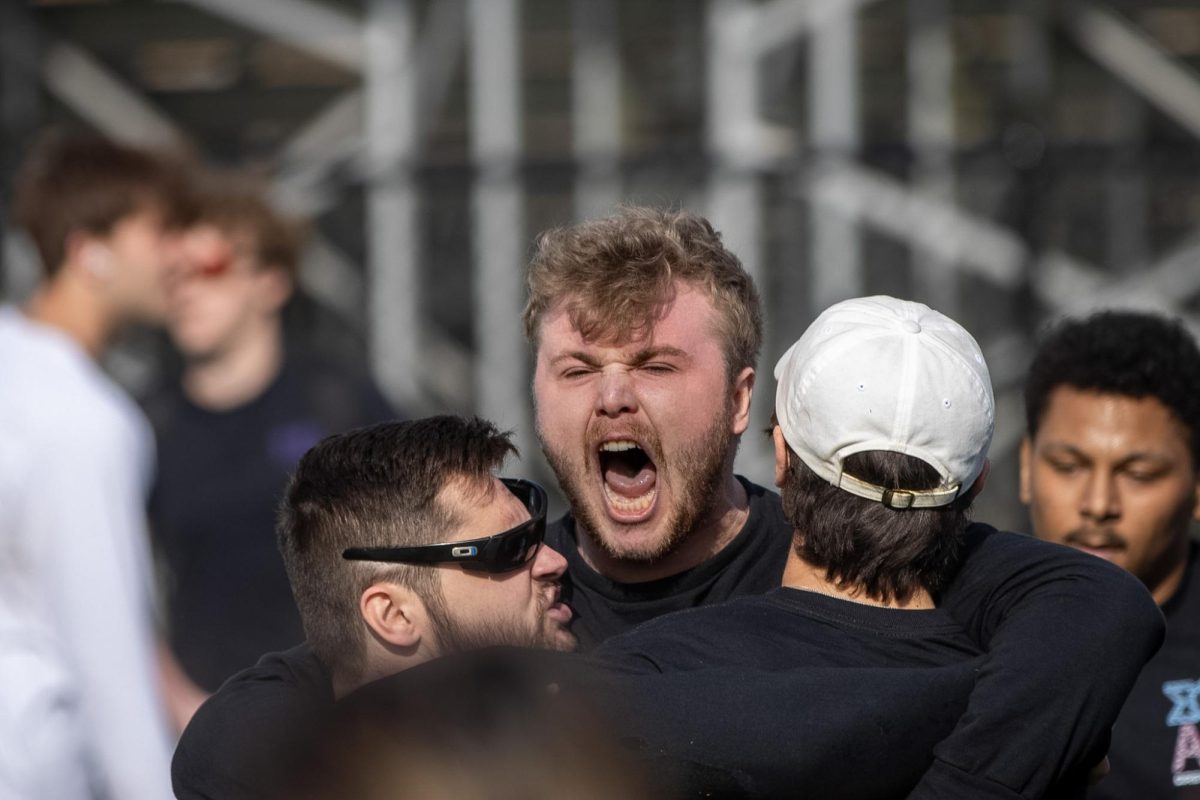 Sigma Phi Epsilon member Jackson Ulm celebrates with fraternity brothers Gavin Lipe and Ethan Kernosky after their match win at the Tugs event during Greek Week across the campus pond on Wednesday afternoon. Sig Ep received third place in Tugs.