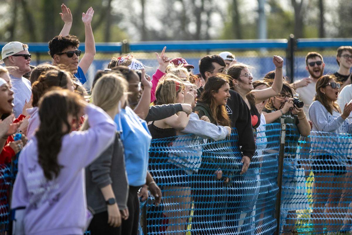 A crowd cheers for Alpha Psi Lambda during their match at the Tugs event during Greek Week across the campus pond on Wednesday afternoon. Alpha Psi Lambda and Iota Phi Theta won Tugs.