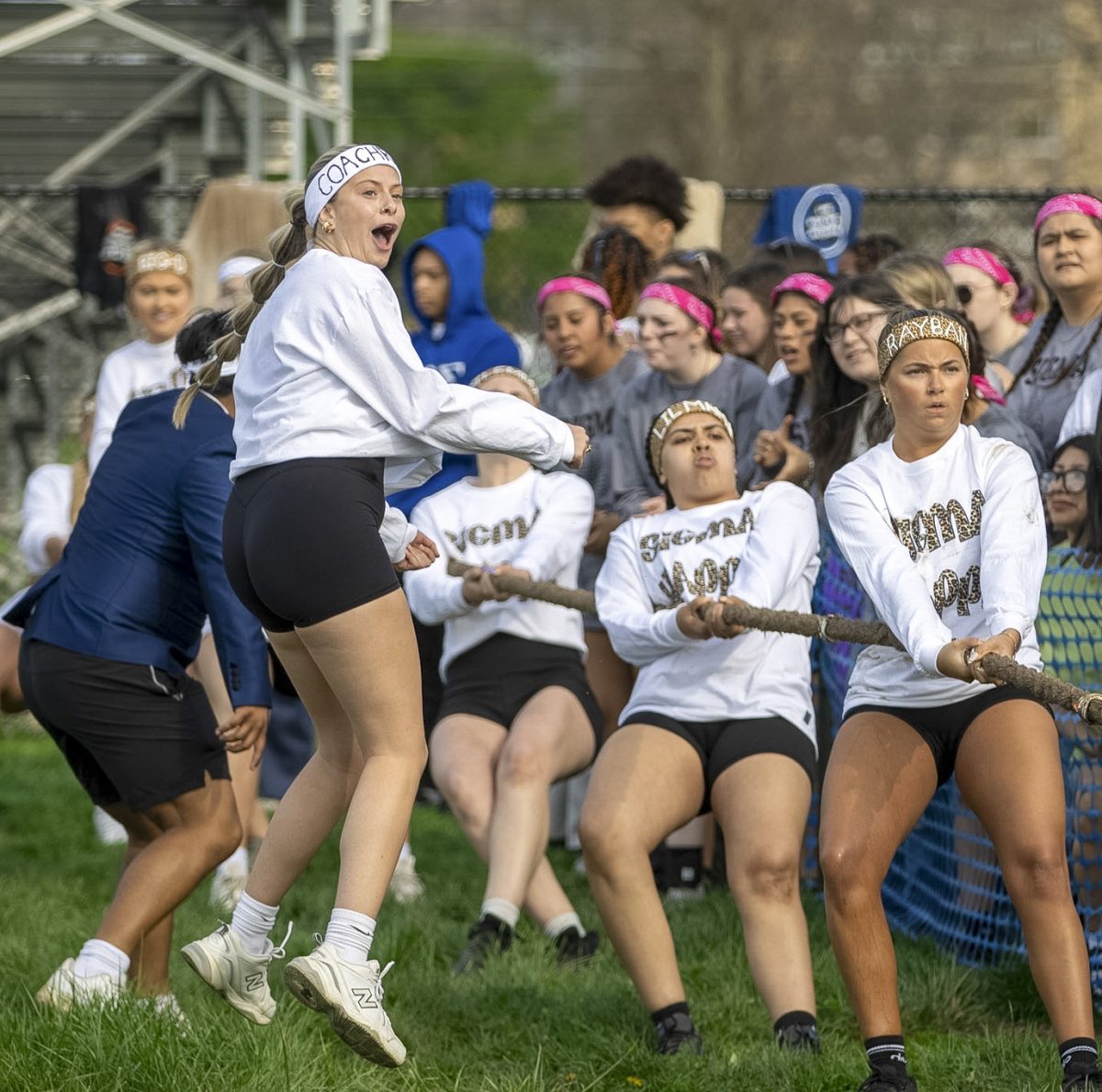 Sigma Kappa coach Chloe Harnetiaux  jumps and cheers for her team at the Tugs event across the campus pond on Wednesday afternoon. Sigma Kappa won first place in Tugs and first place overall with its Greek Week pairing, Sigma Phi.