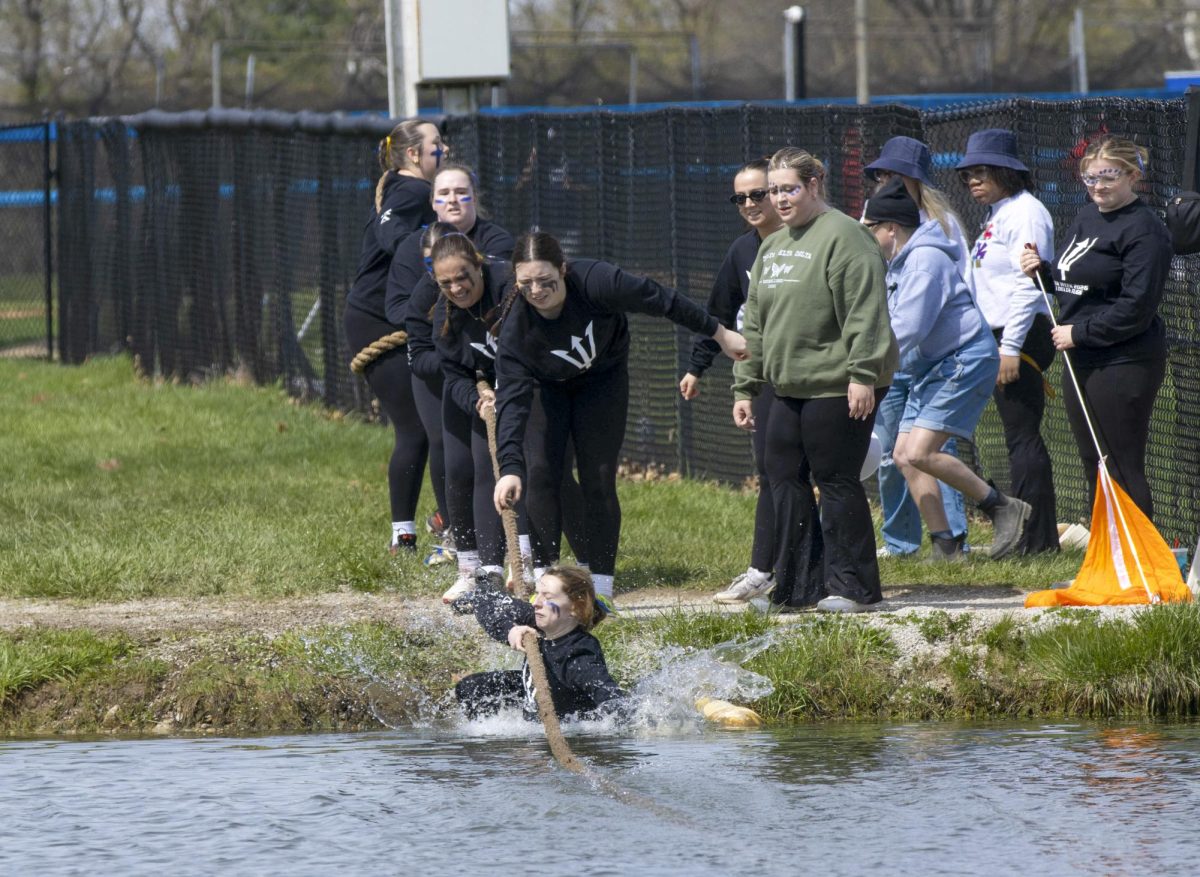 Delta Delta Delta members are pulled into the pond by Sigma Kappa during Tugs finals on Saturday at the Tugs event during Greek Week across the campus pond. Tri Delta received second place during Tugs.