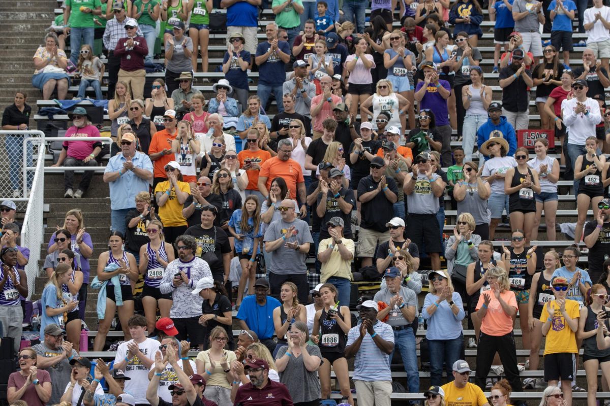 The crowd gives Barrington runner Mia Sirois a standing ovation after her performance in the Class 3A 3200-meter run. Sirois broke the all-time state Class 3A 3200-meter record with a time of 9:44.16.