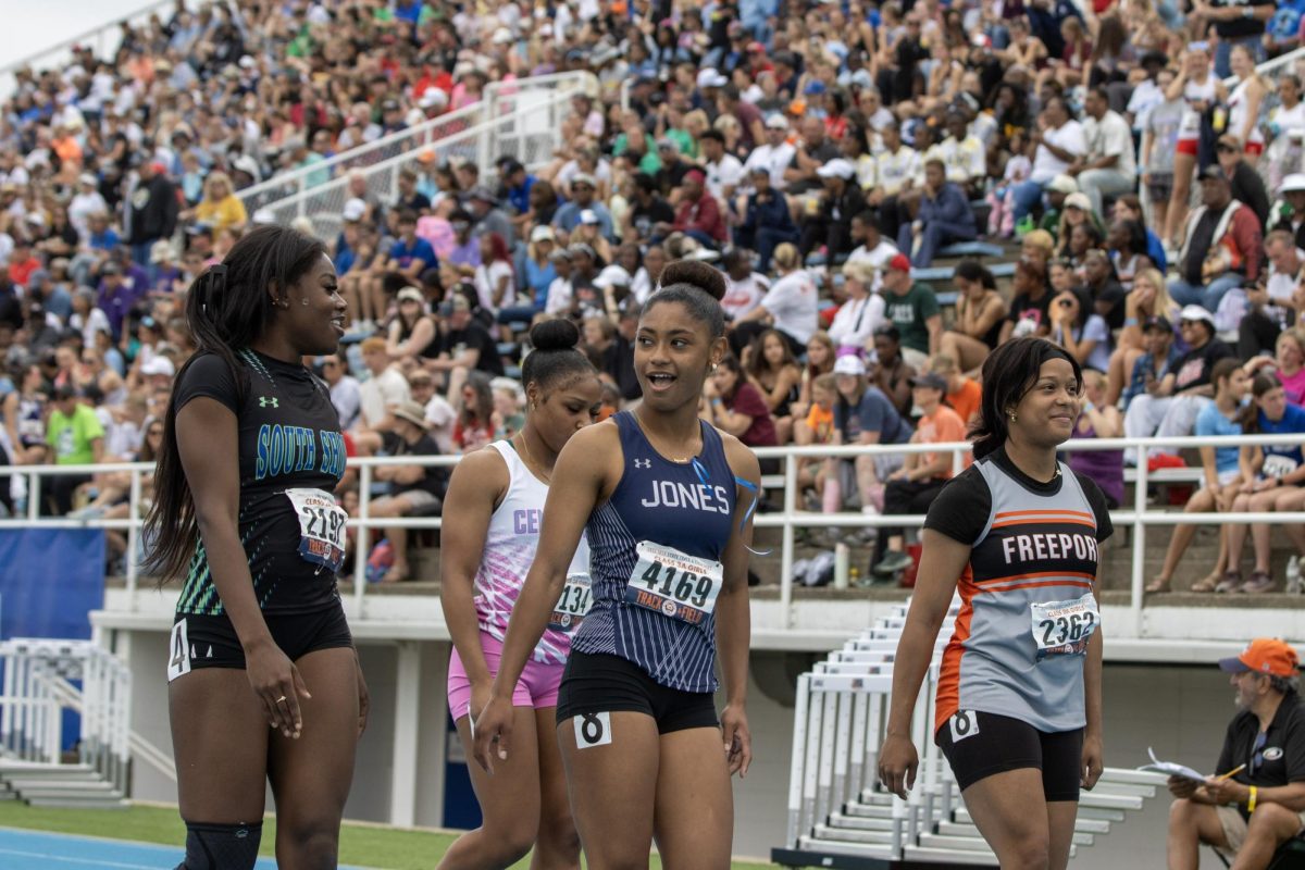 Girls prepare to line up for the Class 2A 100m dash at the IHSA girls' state track and field meet at O'Brien Field on Eastern Illinois University's campus in Charleston, Ill. on Saturday.