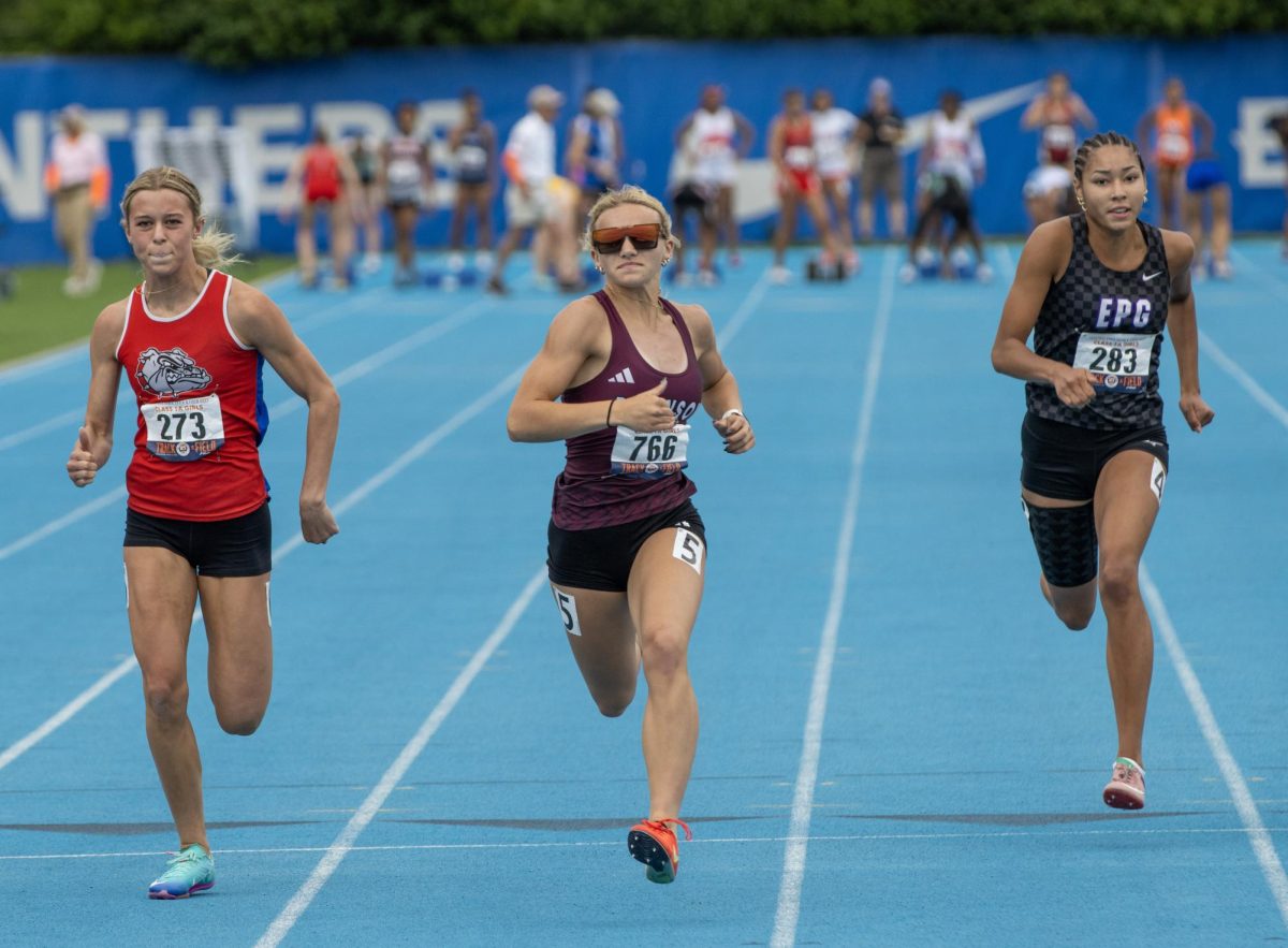 Robinson freshman Austyn McDowell (center), El Paso-Gridley junior Jaida Reed (right), St. Anthony sophomore Reese Hoene (left) race in the Class 1A 100m race at the IHSA girls' state track and field meet at O'Brien Field on Eastern Illinois University's campus in Charleston on Saturday.