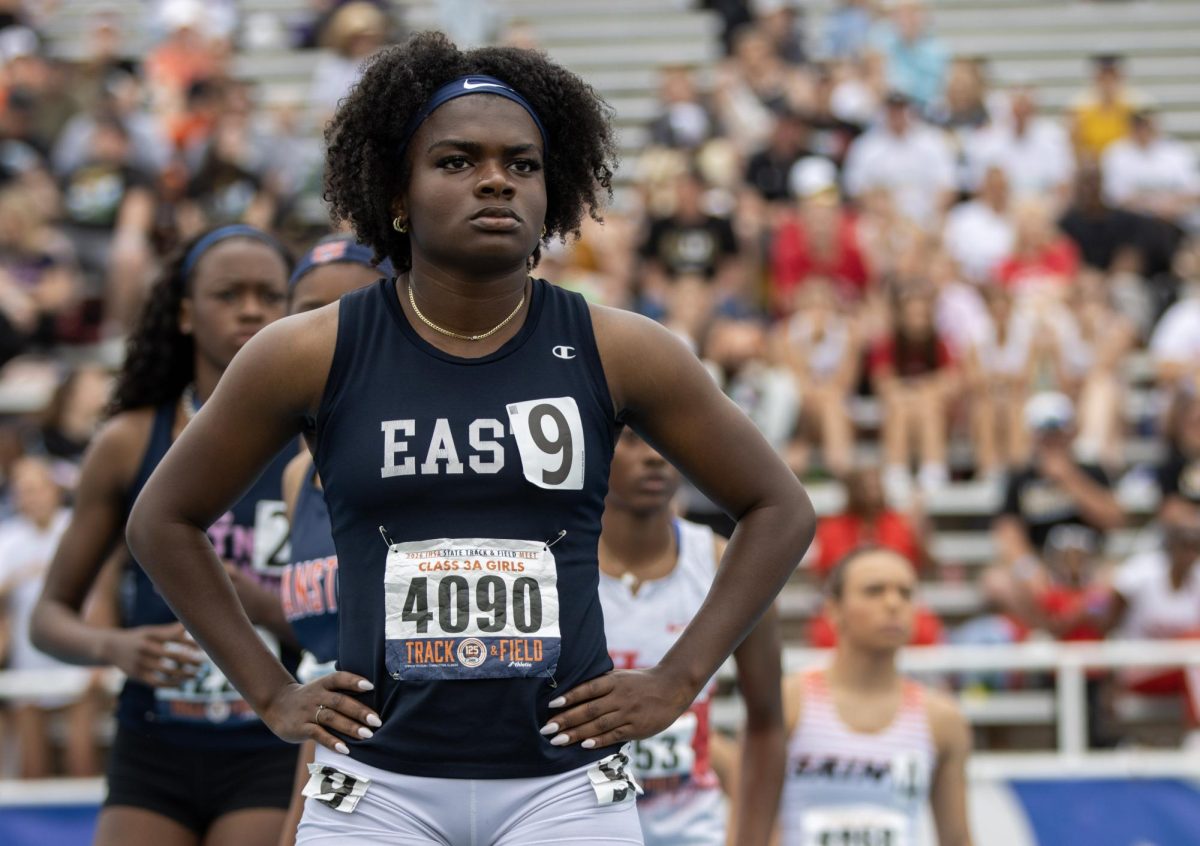 Belleville East runner Kamryn Durrah stands awaiting the start of the Class 3A 4x400m relay race at the IHSA girls' state track and field meet at O'Brien Field on Eastern Illinois University's campus in Charleston on Saturday.