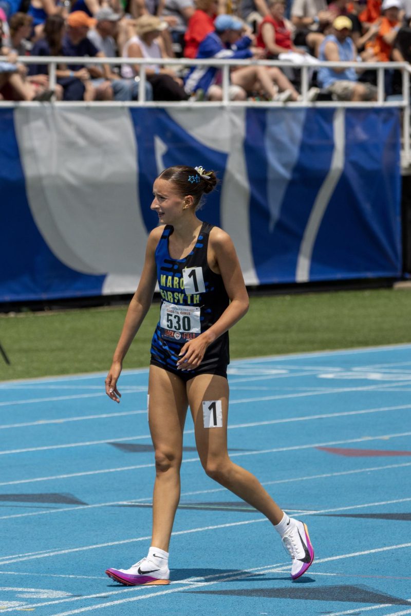 Maroa-Forsyth senior Klaire Eighner stands after finishing in first place in the Class 1A 3200-meter race at the IHSA girls' state track and field meet at O'Brien Field on Eastern Illinois University's campus in Charleston, Ill on Saturday.