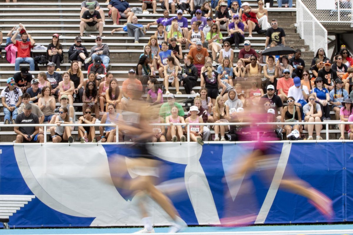 Runners run through the final straightaway during the Class 2A 3200-meter race at the IHSA girls' state track and field meet at O'Brien Field on Eastern Illinois University's campus in Charleston on Saturday.