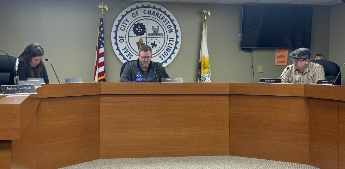 Mayor Brandon Combs (center) introduces the topics of the Charleston City Council meeting on Tuesday, May 5 in city hall.
