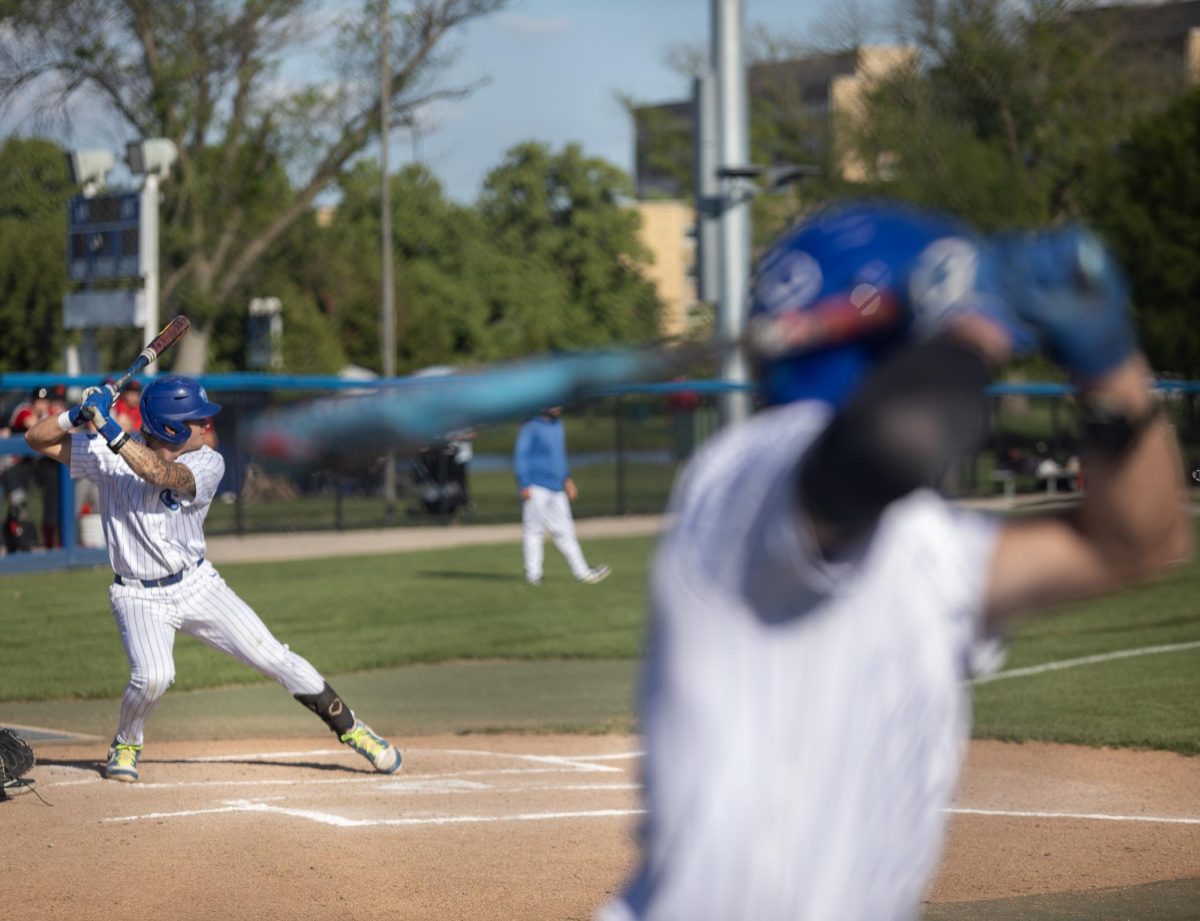 Senior infielder Mike O’Conor (right) stands ready on deck while sophomore infielder James Love (left) prepares for a pitch at the plate during EIU baseball’s loss to Southern Illinois University Edwardsville at Frost Field on Saturday.