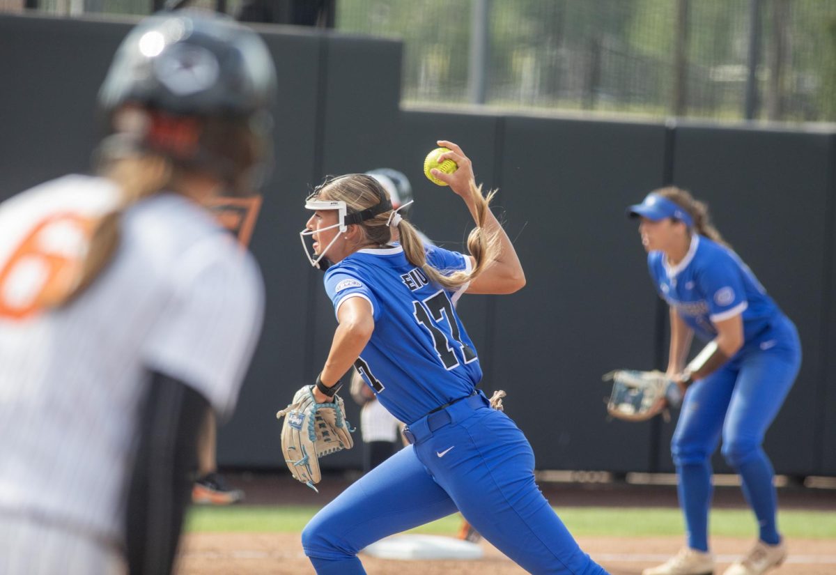 Eastern Illinois University softball senior pitcher Karlie McKenzie throws a pitch while the bases are loaded during EIU’s 16-0 loss to Oklahoma State University in the second game of the NCAA Stillwater Regional on Friday.