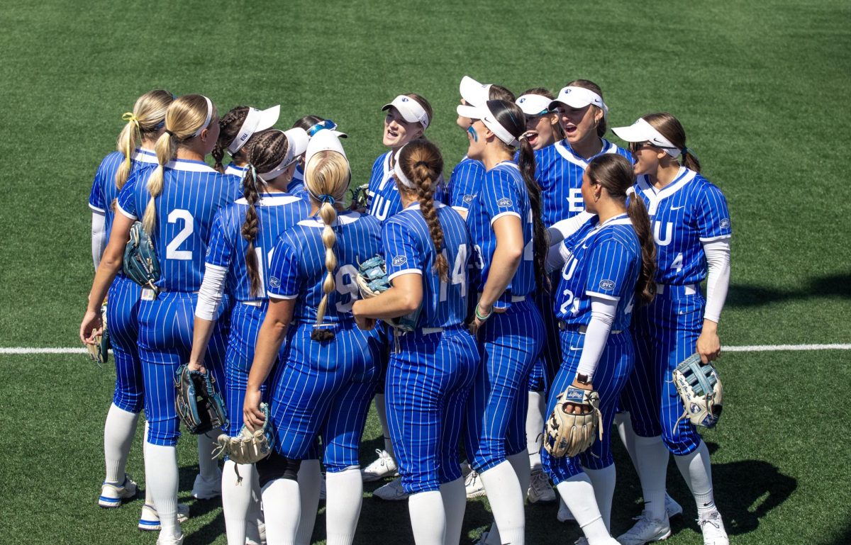 Eastern Illinois University softball team huddles together before the first game of the OVC championship at OSF Healthcare Field at the Louisville Sports Sluggers Complex on Saturday.
