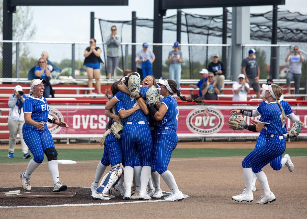 The Eastern Illinois University softball team runs to join in the big group hug after winning the OVC championship at OSF Healthcare Field at the Louisville Sports Sluggers Complex on Saturday.
