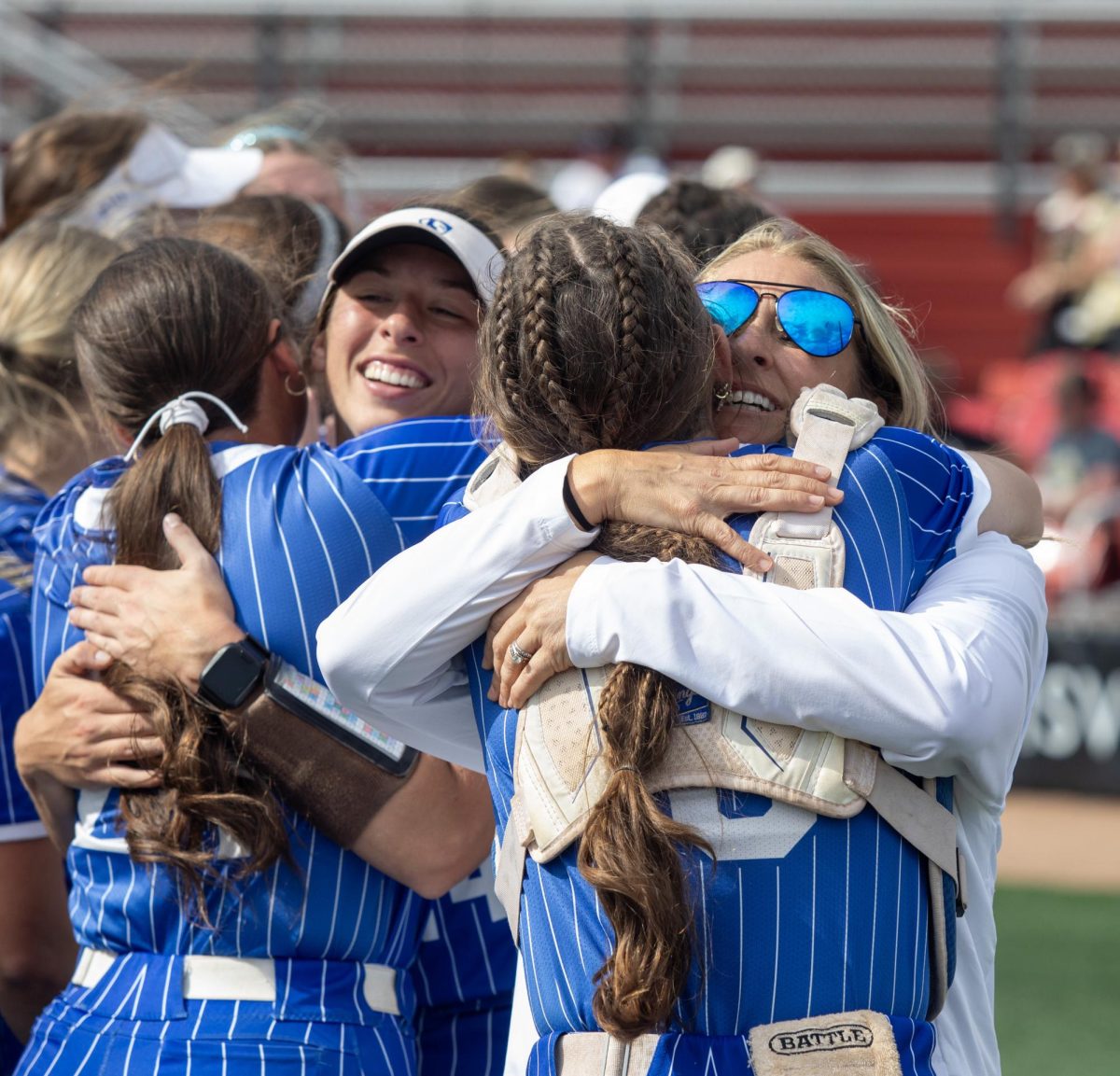 Eastern Illinois University softball team hugs each other after winning the OVC championship at OSF Healthcare Field at the Louisville Sports Sluggers Complex on Saturday.
