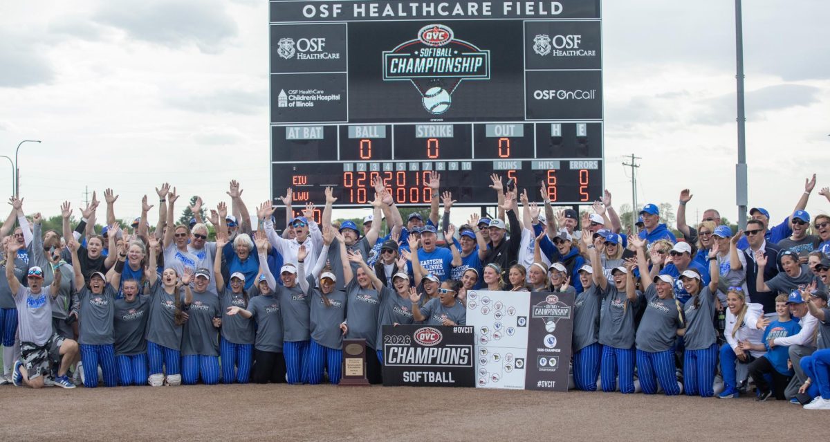 The Eastern Illinois University softball team pose for a photo with their family and fans after winning the OVC championship at OSF Healthcare Field at the Louisville Sports Sluggers Complex on Saturday.