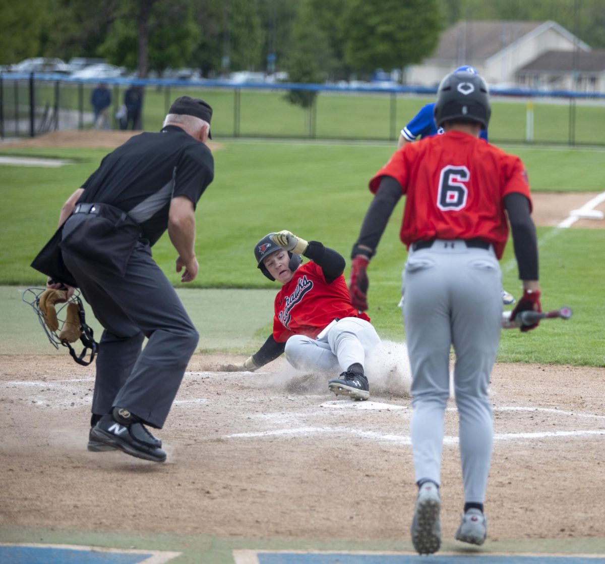 SEMO baseball sophomore Joe Hall (middle) runs to home plate following SEMO senior Demitri Shakotko (right) in the third game in the series against EIU on Sunday on Frost Field where SEMO lost 8-3.