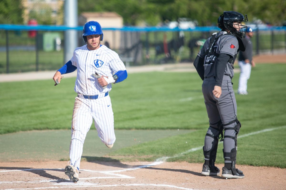 Graduate student Dylan Drumke scores a run during EIU baseball's win over SEMO at Frost Field on Saturday.