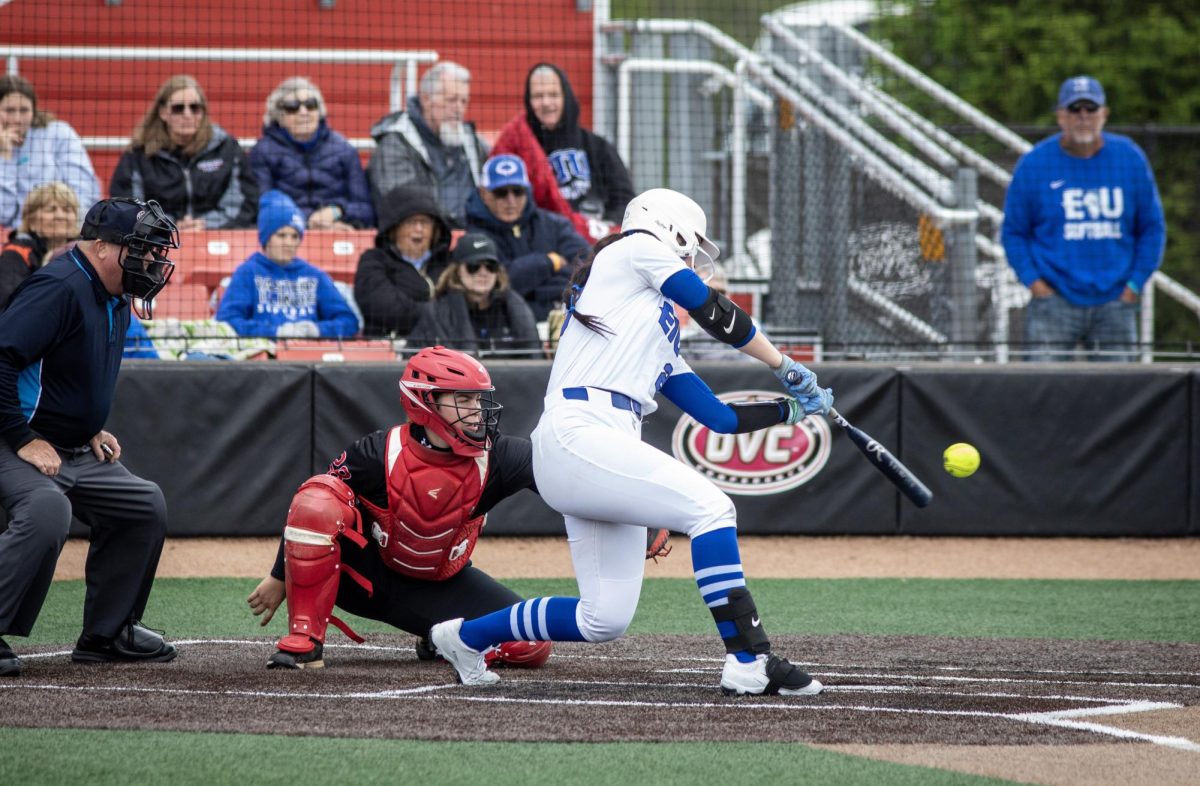 Eastern Illinois University softball sophomore utility player Abbi Hatton (right) swings at a pitch while Southeast Missouri State junior catcher Raigan Brannon (left) catches the ball during EIU’s 7-6 win against Southeast Missouri State in the first round of the Ohio Valley Conference tournament.