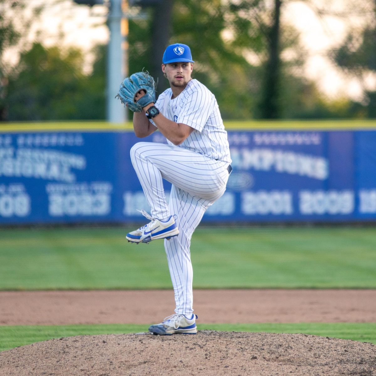 Junior pitcher Bryce Riggs winds up to throw a pitch during the EIU baseball panther's win over SEMO at Frost Field on Saturday.