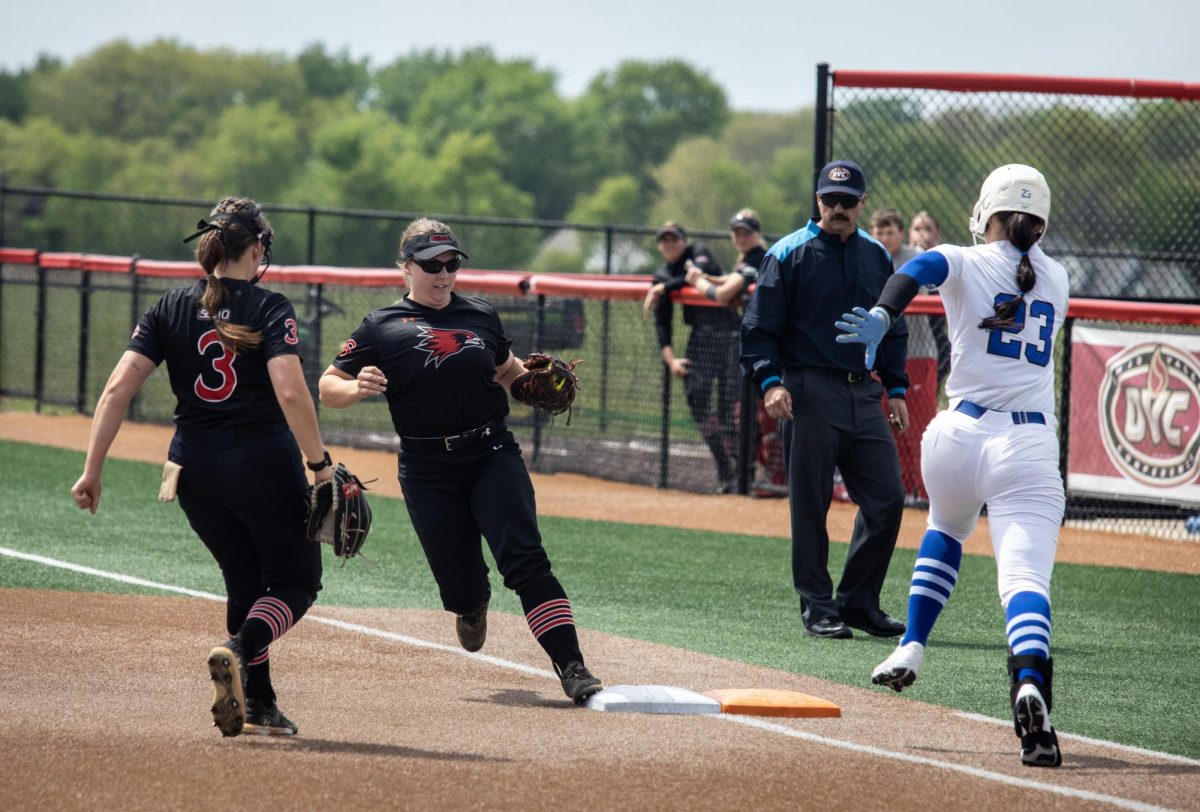 Eastern Illinois University softball sophomore utility player Abbi Hatton (right) runs at first base as Southeast Missouri State senior infielder Aubrie Shore (center) gets to first base for the out while junior pitcher Willow Van Haren (left) runs to first base as well during EIU’s 7-6 win against Southeast Missouri State in the first round of the Ohio Valley Conference tournament.