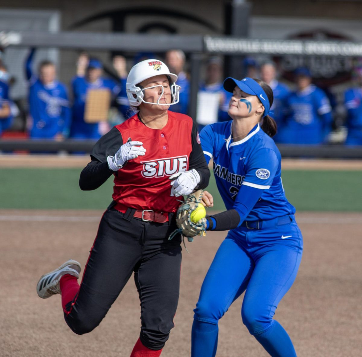 Eastern Illinois University softball sophomore utility player Abbi Hatton (right) tags out Southern Illinois University Edwardsville sophomore outfielder Abby Harvell (left) during EIU’s 8-0 win against SIUE in the semifinals of the Ohio Valley Conference tournament at OSF Healthcare Field at the Louisville Sports Sluggers Complex on Friday.