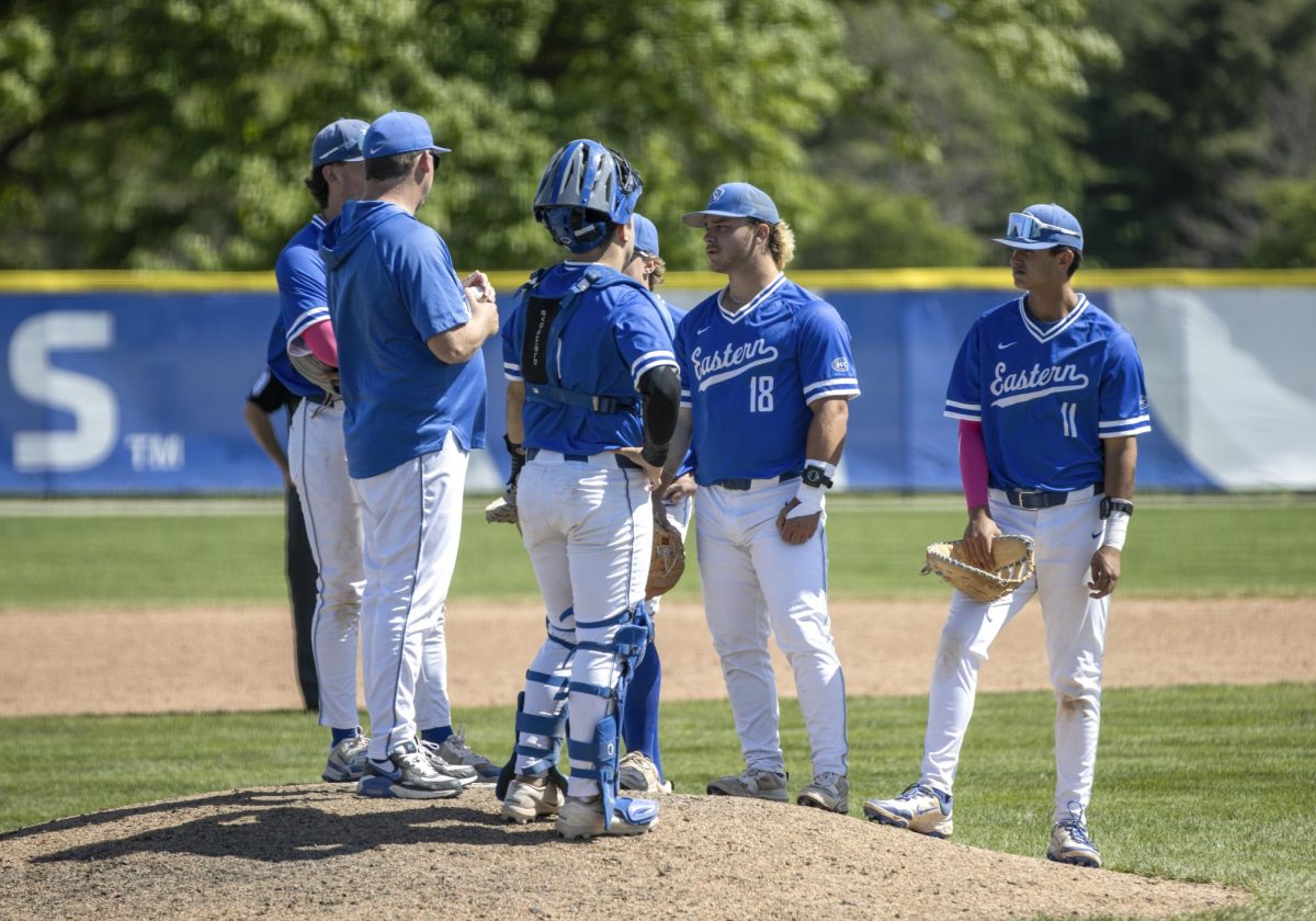 EIU head coach Jason Anderson huddles the infield up as he puts a new pitcher in the game during SIUE's 20-9 victory against EIU on Sunday at Frost Field at Coaches Field.