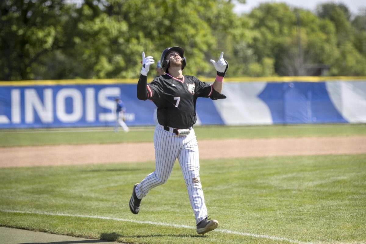 SIUE graduate student second baseman Mack Mitchell points to the sky as he celebrates his second home run of the game during SIUE’s 20-9 victory against EIU at Frost Field at Coaches Field on Sunday.