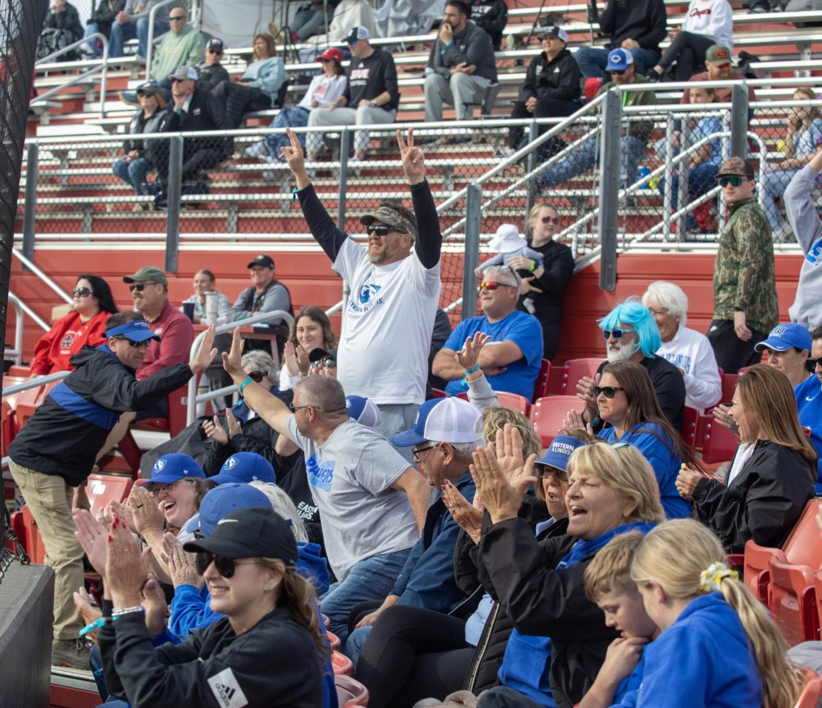Eastern Illinois University softball fans cheer in the stands during EIU’s 8-0 win against SIUE in the semifinals of the Ohio Valley Conference tournament at OSF Healthcare Field at the Louisville Sports Sluggers Complex on Friday.