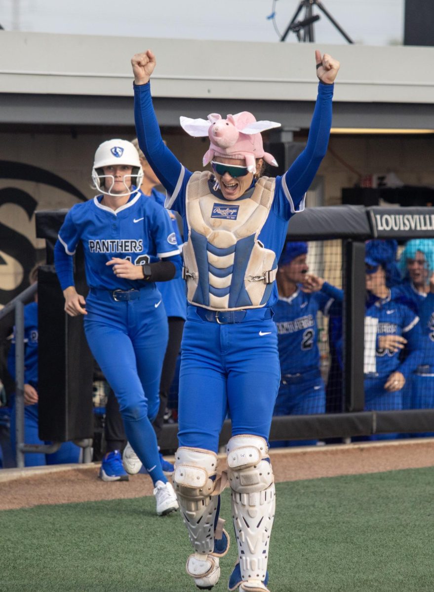 Eastern Illinois University softball junior catcher Sophia Olman runs out of the dugout in celebration after a home run during EIU’s 8-0 win against Southern Illinois Edwardsville in the semifinals of the Ohio Valley Conference tournament at OSF Healthcare Field at the Louisville Sports Sluggers Complex on Friday.