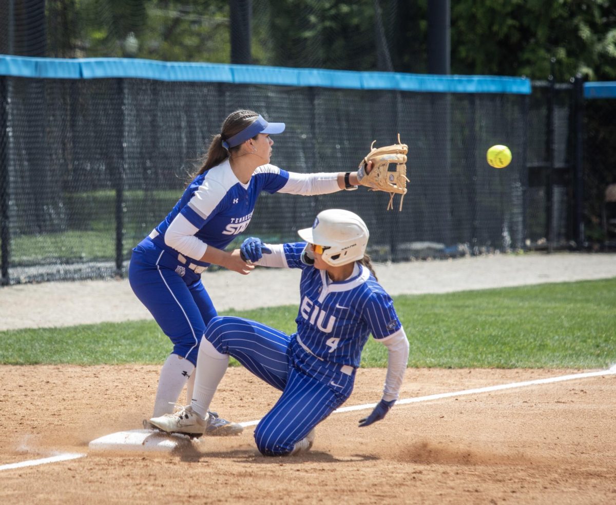 Eastern Illinois University softball sophomore outfielder Morgan Hance (right) slides into third base under Tennessee State University freshman infielder Dani James (left) during EIU’s 15-0 win over TSU at Williams field on Saturday.