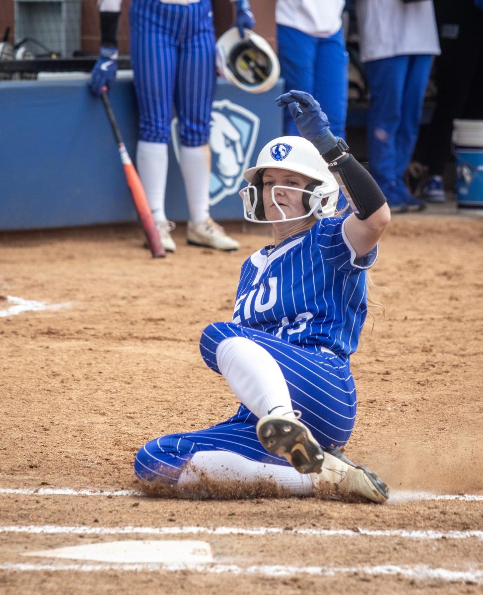 Eastern Illinois University softball junior outfielder Alisha Frederick slides into home plate during EIU’s 15-0 win over Tennessee State University at Williams field on Saturday.
