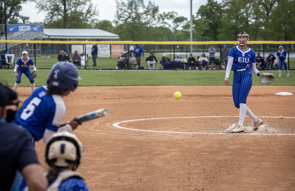 Eastern Illinois University softball senior pitcher Karlie McKenzie (right) throws a pitch to Tennessee State University junior infielder Alexis Woods (left) during EIU’s 15-0 win over Tennessee State University at Williams field on Saturday.
