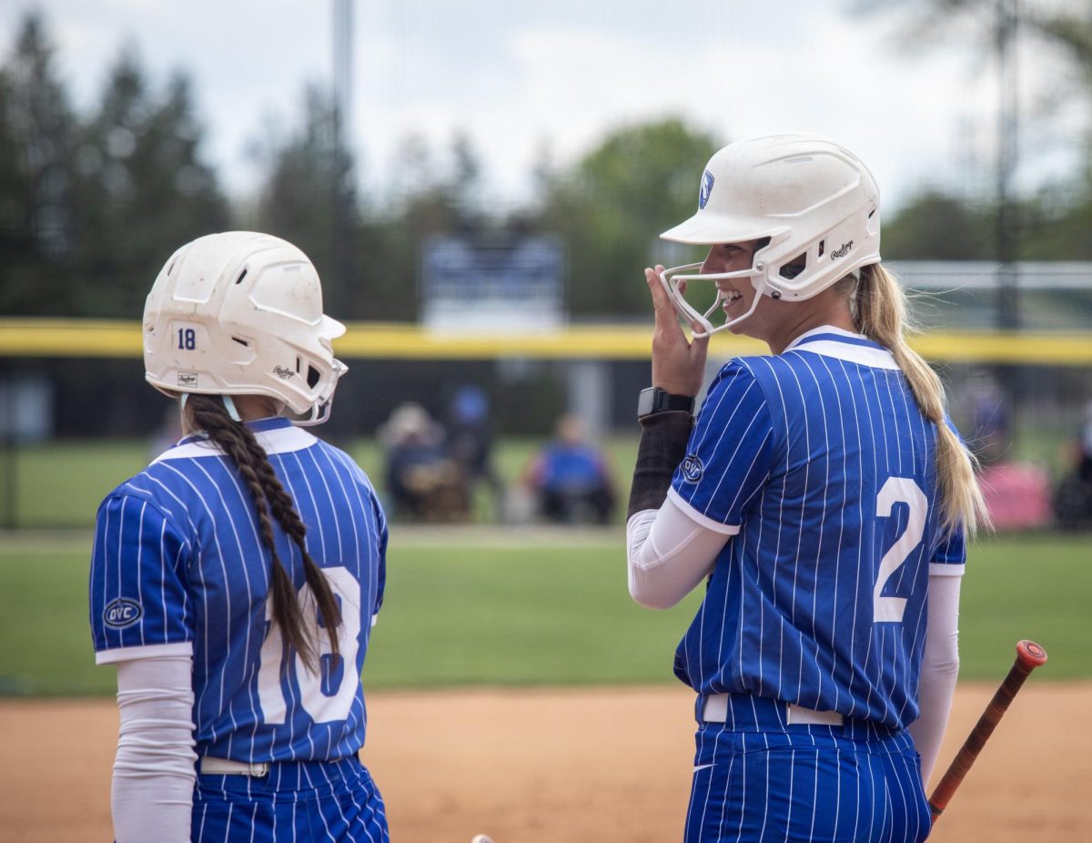 Eastern Illinois University softball junior Emily Konkel (right) talks with junior infielder Chloe Wamboldt (left) after Konkel’s at bat during EIU’s 15-0 win over Tennessee State University at Williams field on Saturday.