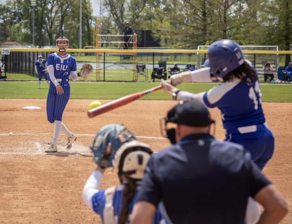 Eastern Illinois University softball senior pitcher Karlie McKenzie (left) pitches to sophomore outfielder Hailey Hunt (right) during EIU’s 15-0 win over Tennessee State University at Williams field on Saturday.