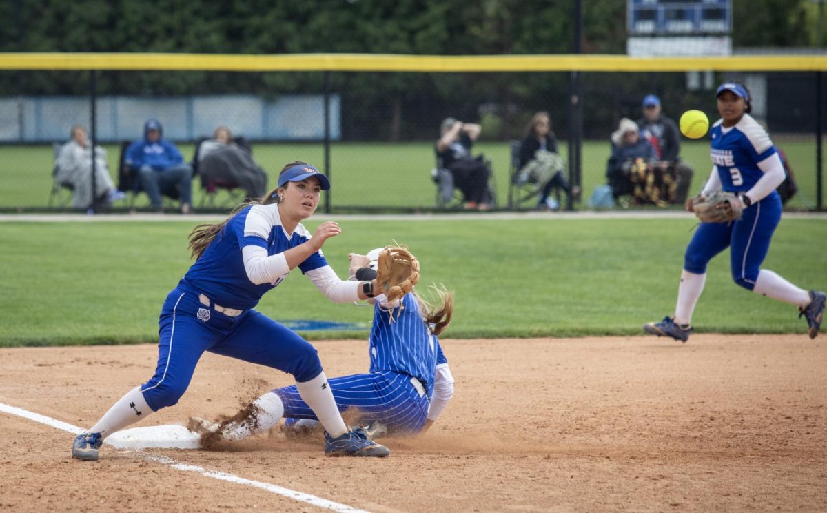Eastern Illinois University softball freshman infielder Sydney Donaldson (right) slides into third base as Tennessee State University freshman infielder Dani Jones (left) tries to tag her out during EIU’s 15-0 win over Tennessee State University at Williams field on Saturday.